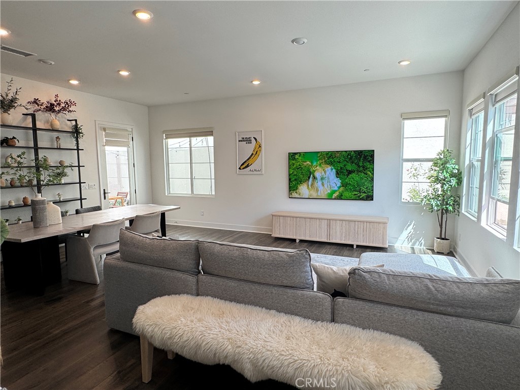 124 Yugen Irvine, CA 92618 - Photo 3 of 31 a living room with furniture and a flat screen tv