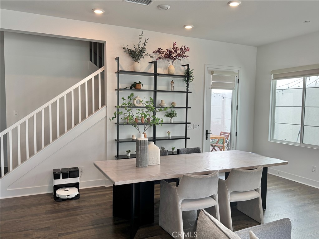 124 Yugen Irvine, CA 92618 - Photo 4 of 31 a view of a dining room with furniture and wooden floor