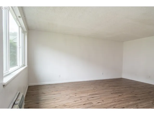 a view of an empty room and window