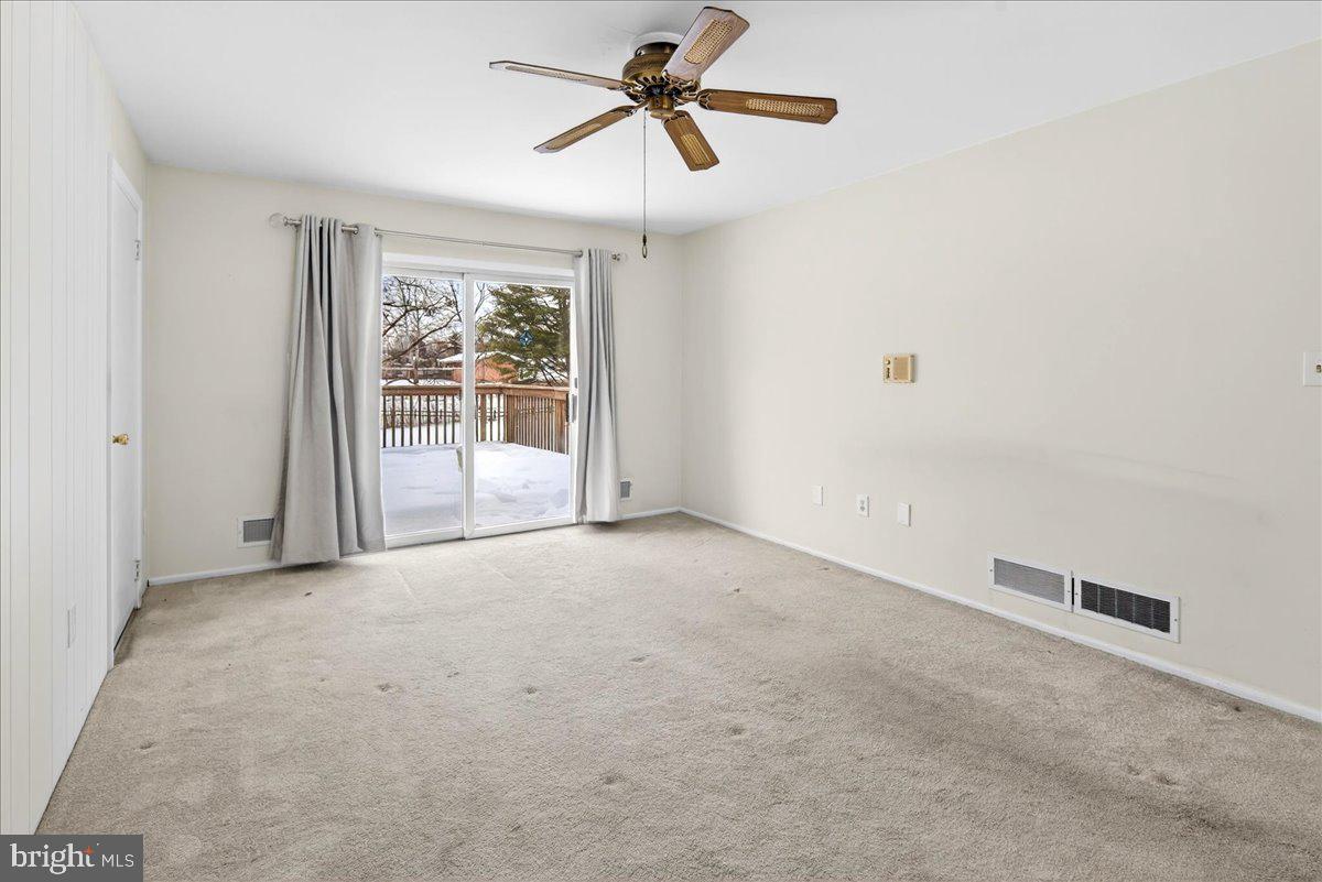 6 Royal Oak Road Lawrence Township, NJ 08648 - Photo 12 of 27 a view of a livingroom with a ceiling fan and window