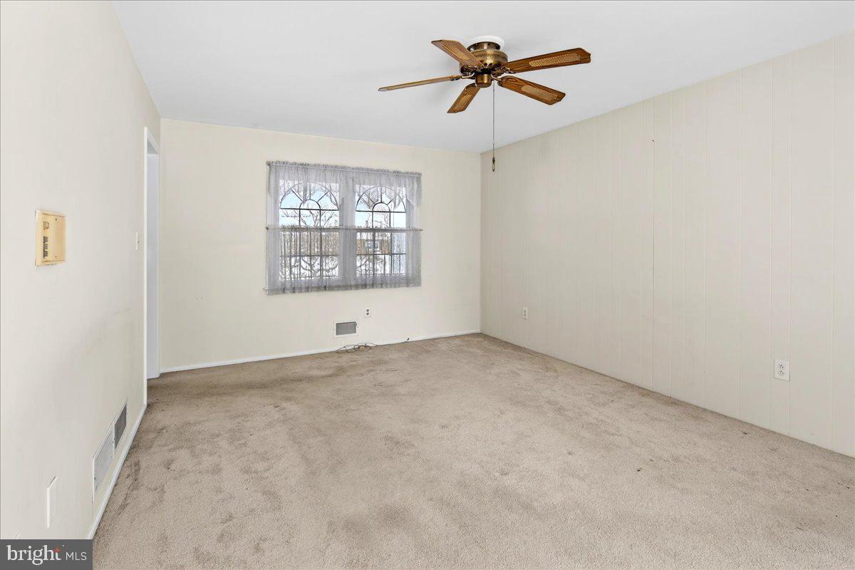 6 Royal Oak Road Lawrence Township, NJ 08648 - Photo 13 of 27 an empty room with a window and a ceiling fan