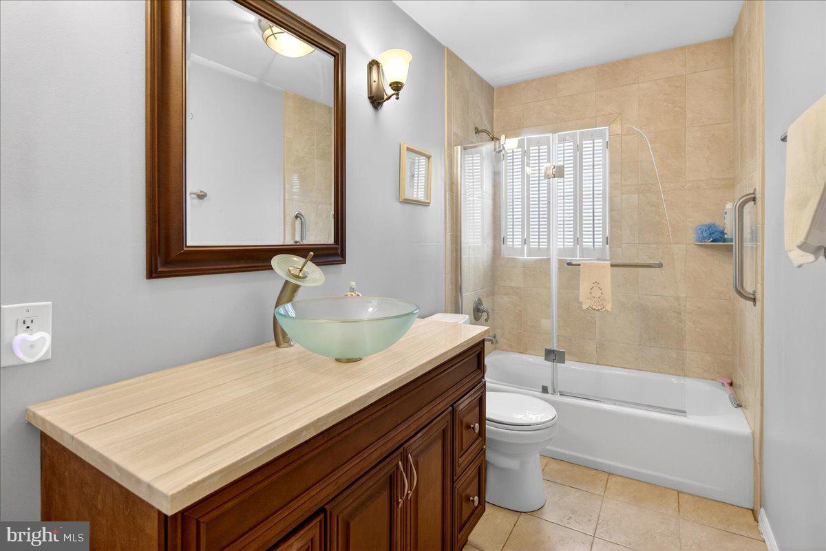 6 Royal Oak Road Lawrence Township, NJ 08648 - Photo 14 of 27 a bathroom with a sink a toilet and shower