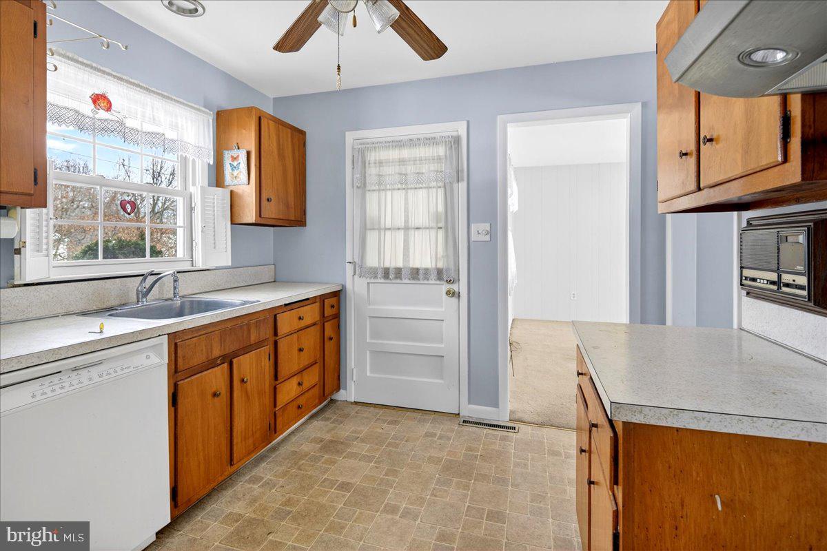 6 Royal Oak Road Lawrence Township, NJ 08648 - Photo 5 of 27 a kitchen with stainless steel appliances granite countertop a sink and cabinets