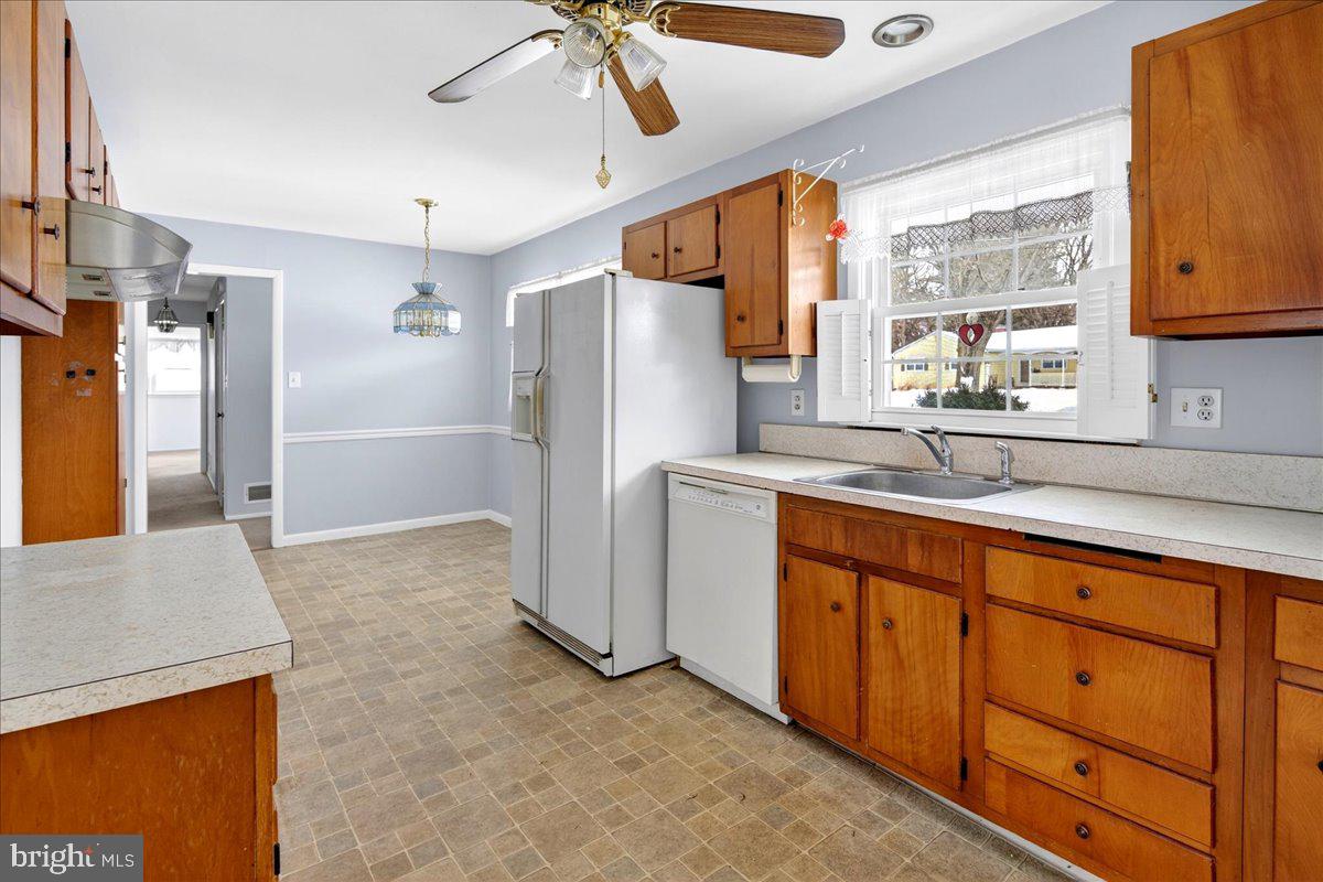 6 Royal Oak Road Lawrence Township, NJ 08648 - Photo 6 of 27 a kitchen with stainless steel appliances a refrigerator and a sink