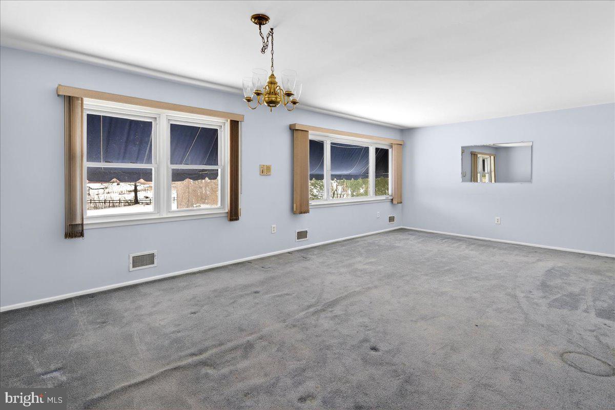 6 Royal Oak Road Lawrence Township, NJ 08648 - Photo 7 of 27 a view of an empty room with a window