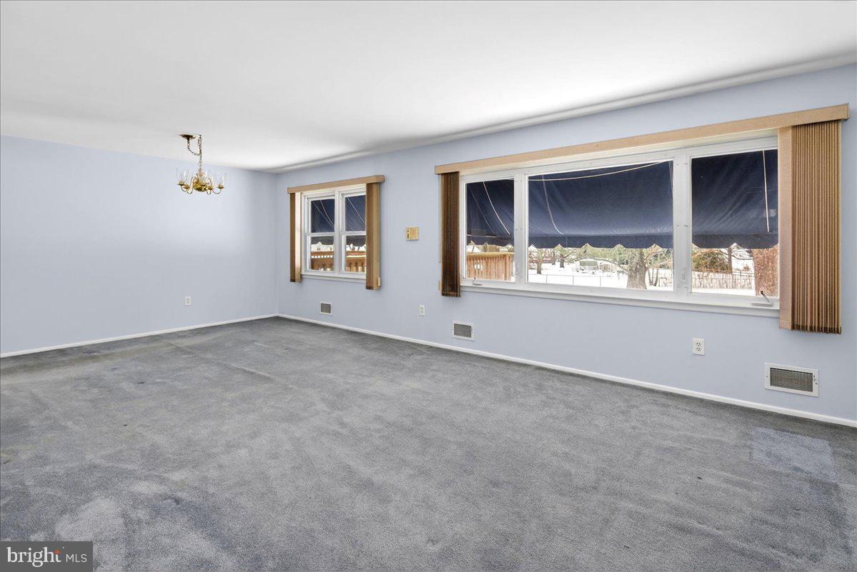 6 Royal Oak Road Lawrence Township, NJ 08648 - Photo 8 of 27 a view of an empty room with a window
