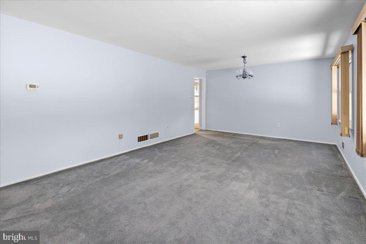 6 Royal Oak Road Lawrence Township, NJ 08648 - Photo 9 of 27 an empty room with a empty space and windows