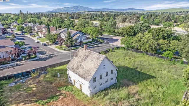 a view of a garden with an outdoor seating