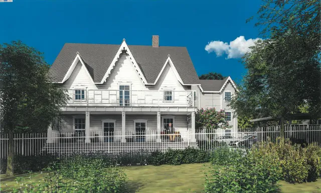 a view of house with garden and tall tress