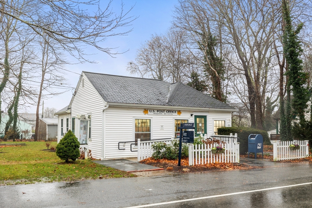 36 Carriage Shop Road Falmouth, MA 02536 - Photo 1 of 9 a front view of a house with a garden and plants