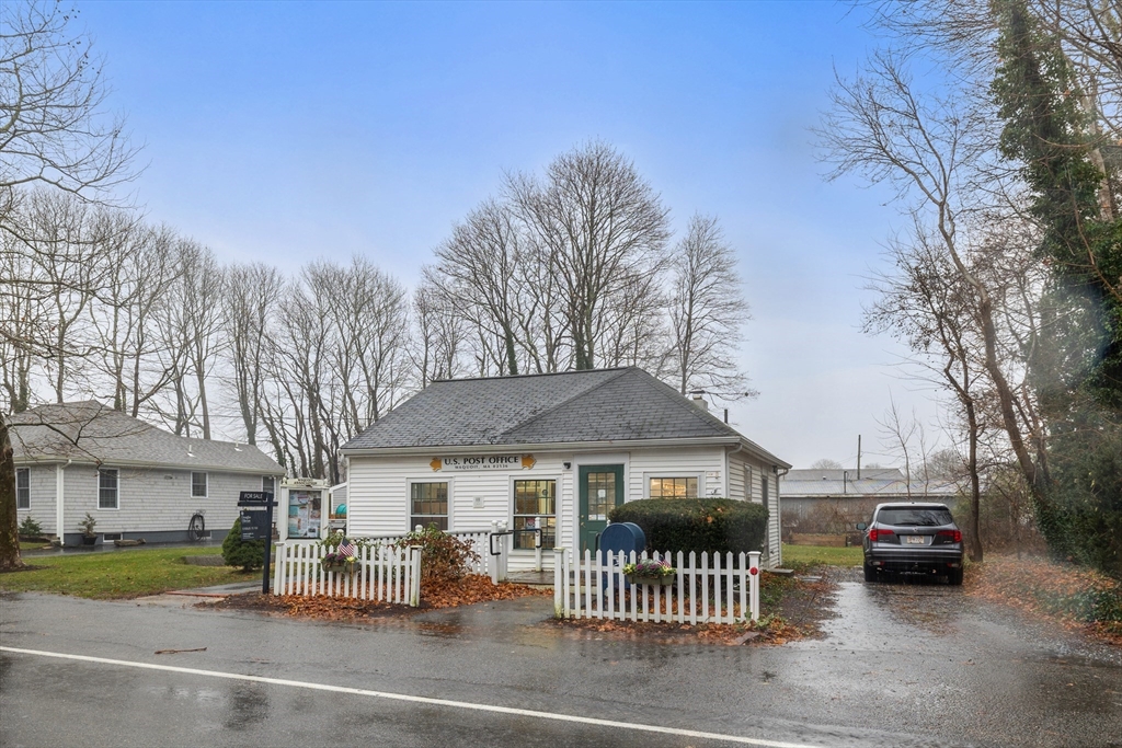 36 Carriage Shop Road Falmouth, MA 02536 - Photo 2 of 9 a front view of a house with a garden