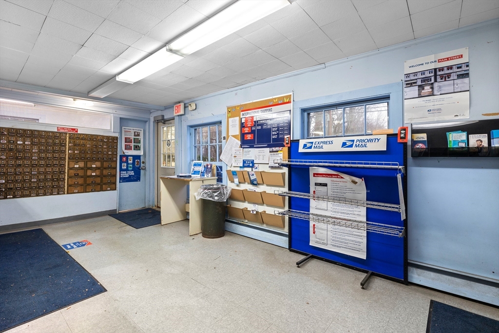36 Carriage Shop Road Falmouth, MA 02536 - Photo 8 of 9 a living room with furniture and a flat screen tv