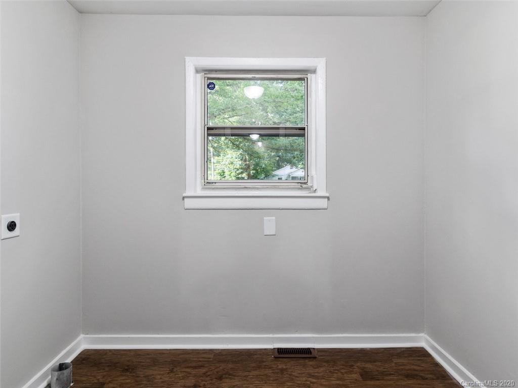 1609 Scott Road Statesville, NC 28625 - Photo 14 of 35 an empty room with wooden floor and a window