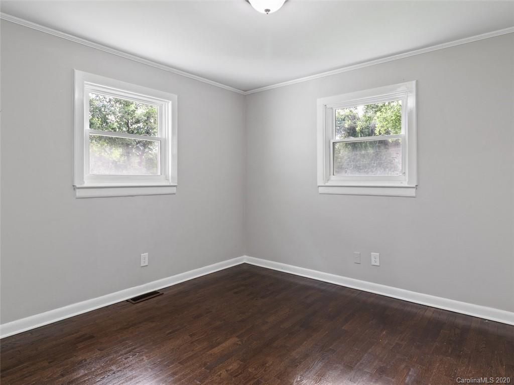 1609 Scott Road Statesville, NC 28625 - Photo 20 of 35 a view of an empty room with wooden floor and a window