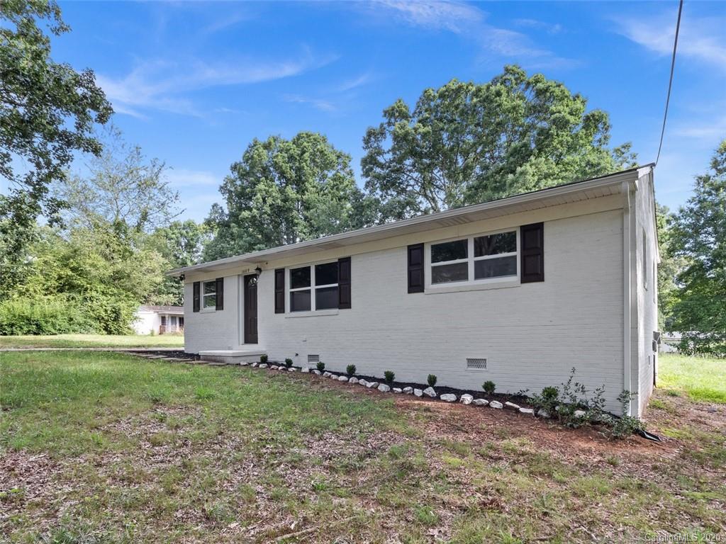 1609 Scott Road Statesville, NC 28625 - Photo 3 of 35 a house with trees in the background