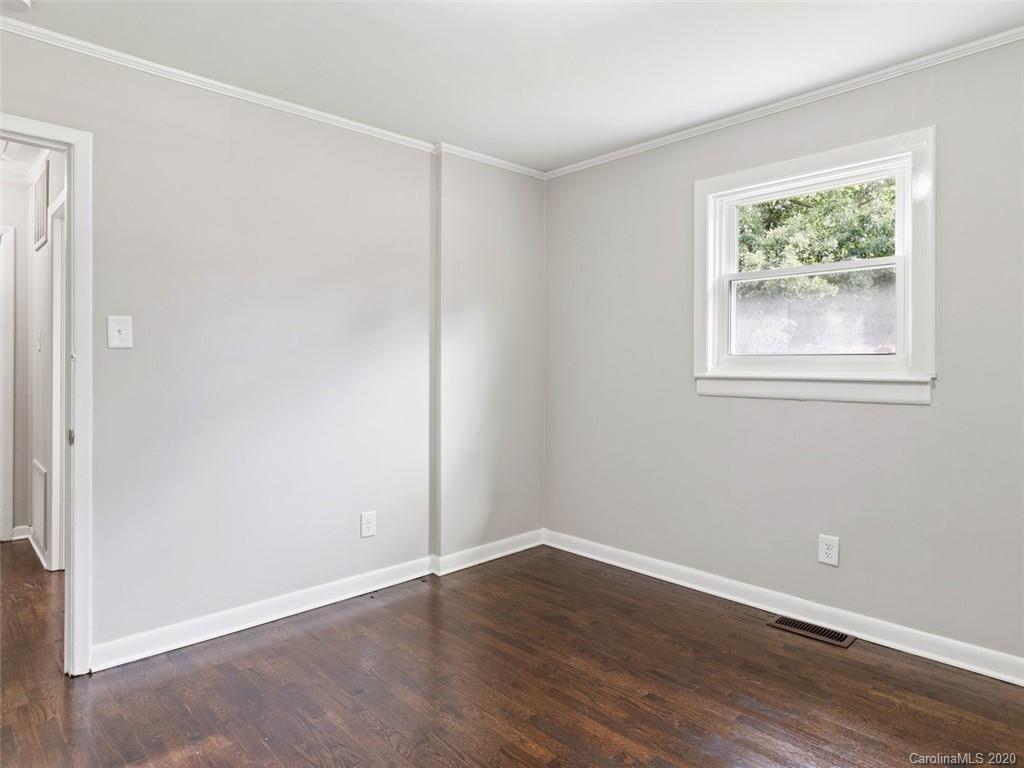 1609 Scott Road Statesville, NC 28625 - Photo 22 of 35 an empty room with wooden floor and window