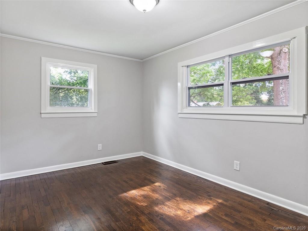 1609 Scott Road Statesville, NC 28625 - Photo 23 of 35 an empty room with wooden floor and windows