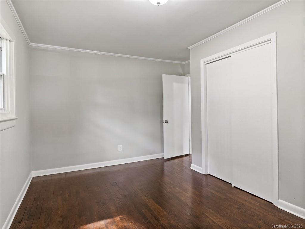 1609 Scott Road Statesville, NC 28625 - Photo 24 of 35 an empty room with wooden floor and windows