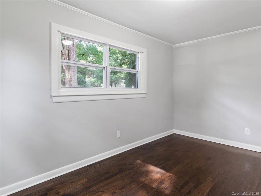 1609 Scott Road Statesville, NC 28625 - Photo 25 of 35 an empty room with wooden floor and windows