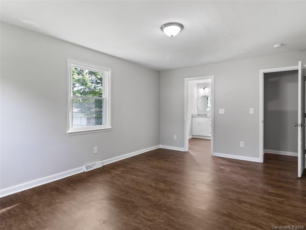 1609 Scott Road Statesville, NC 28625 - Photo 27 of 35 an empty room with wooden floor and windows