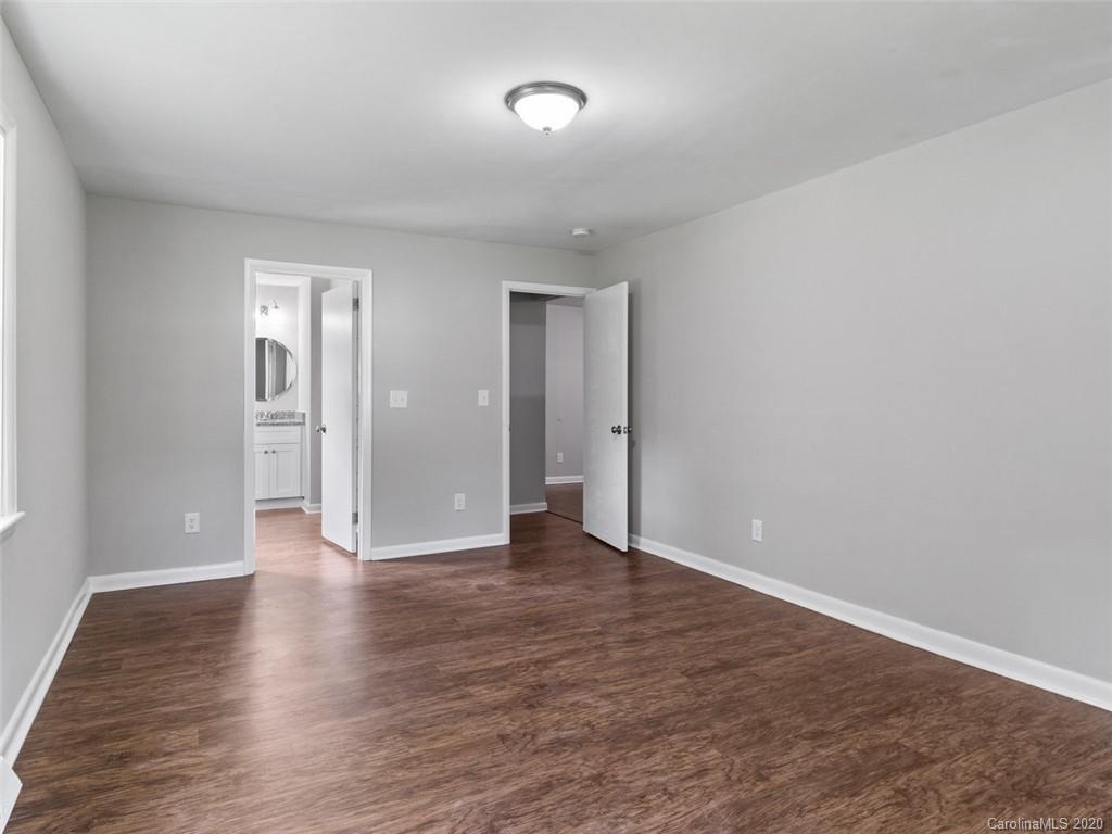 1609 Scott Road Statesville, NC 28625 - Photo 28 of 35 a view of an empty room with wooden floor and a window