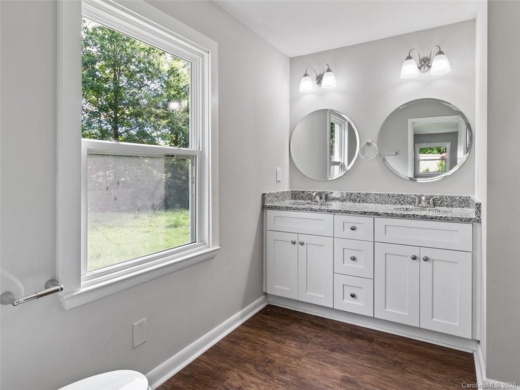 1609 Scott Road Statesville, NC 28625 - Photo 29 of 35 a bathroom with a granite countertop double vanity sink and a window