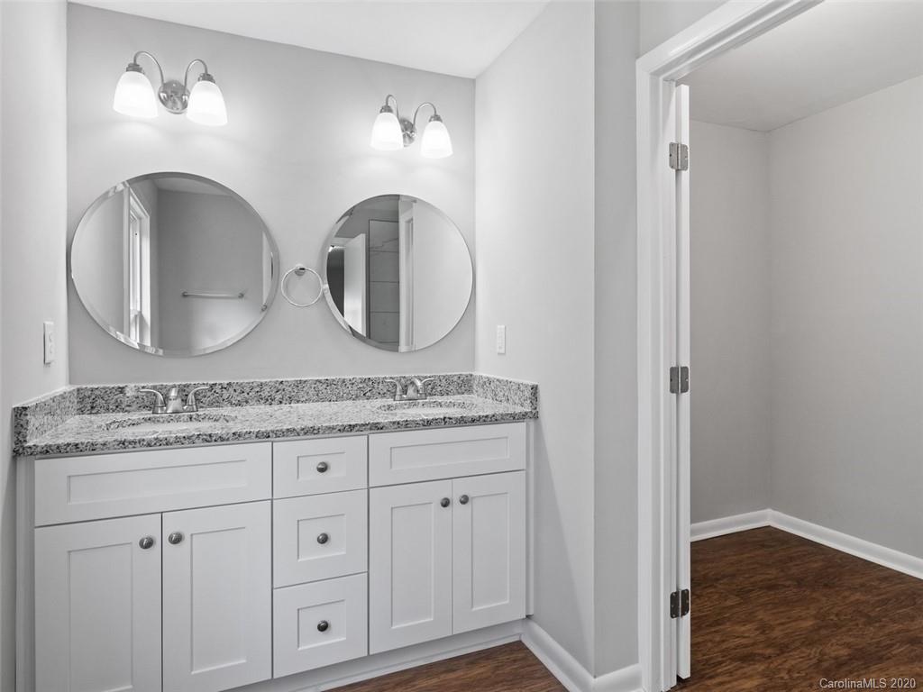 1609 Scott Road Statesville, NC 28625 - Photo 31 of 35 a bathroom with a granite countertop double vanity sink and mirror