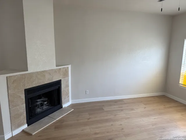 a living room with a fireplace