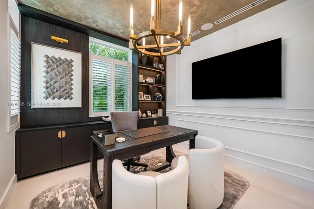 a kitchen with stainless steel appliances kitchen island granite countertop a stove a sink and a microwave