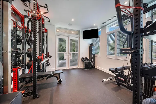 a kitchen with kitchen island granite countertop a sink stainless steel appliances and white cabinets