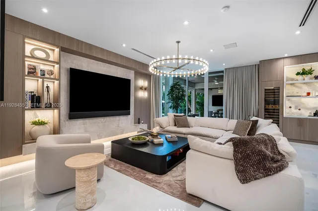 a large kitchen with stainless steel appliances kitchen island a large counter tops a stove a sink and a cabinets