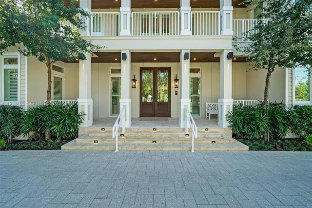 a bathroom with a granite countertop toilet a sink and mirror