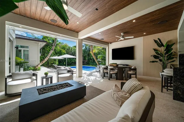 a view of a hallway with wooden floor and entryway