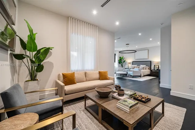 a living room with furniture gym equipment and a window