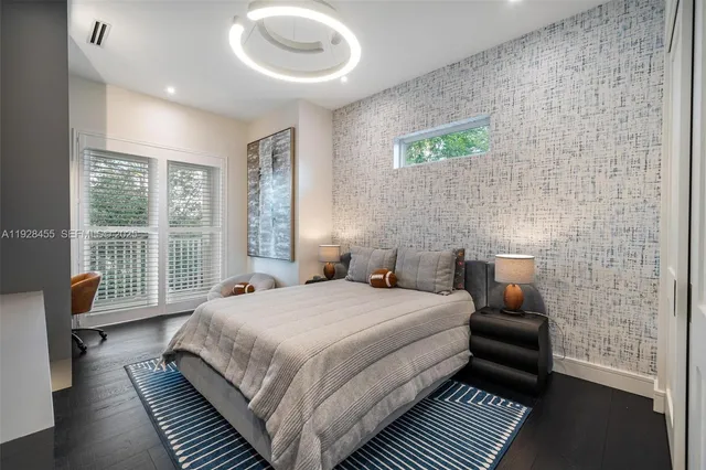 an aerial view of a house with garden space and street view