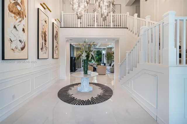a living room with fireplace furniture and a large window