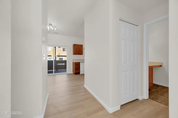a large kitchen with stainless steel appliances granite countertop a stove a sink and a refrigerator