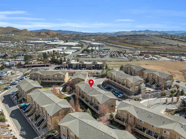 an aerial view of a kitchen with outdoor seating