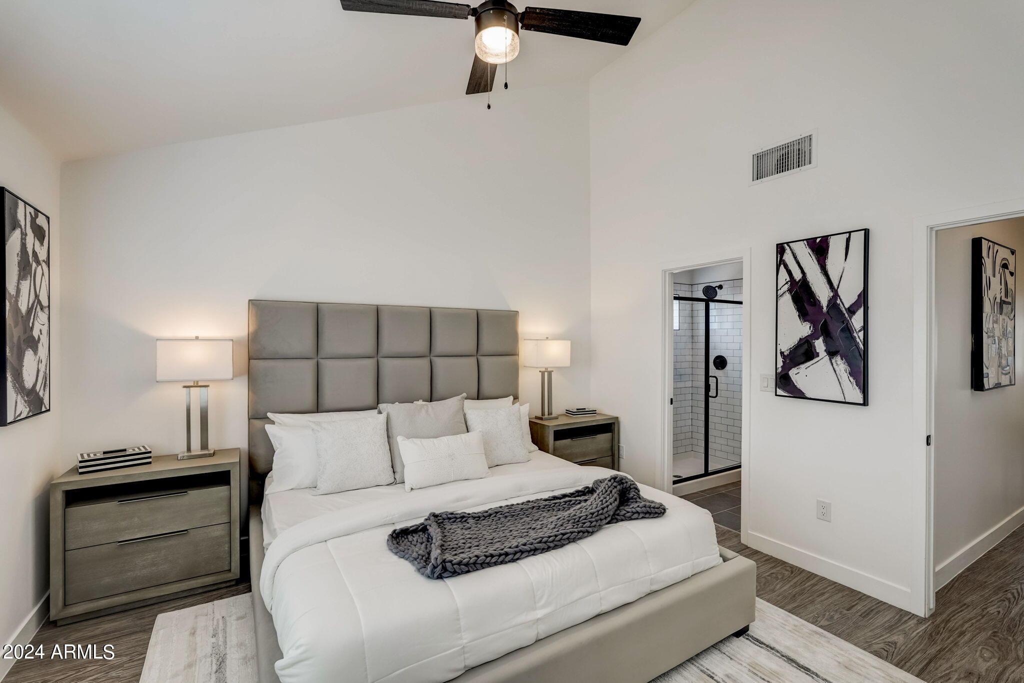 3645 East Earll Drive, Unit 15 Phoenix, AZ 85018 - Photo 15 of 27 a bedroom with a bed and ceiling fan