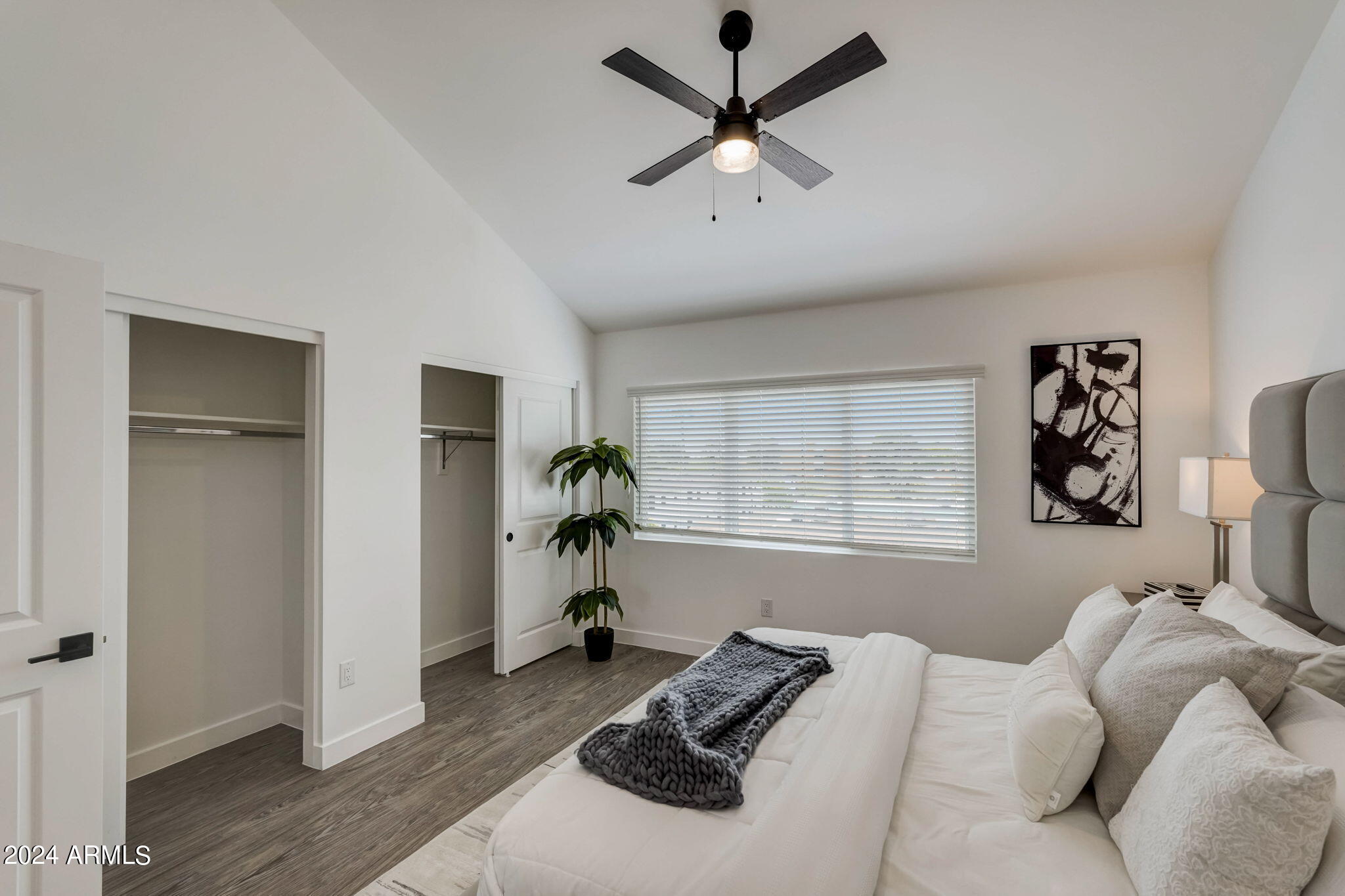 3645 East Earll Drive, Unit 15 Phoenix, AZ 85018 - Photo 17 of 27 a bed room with a bed and a window