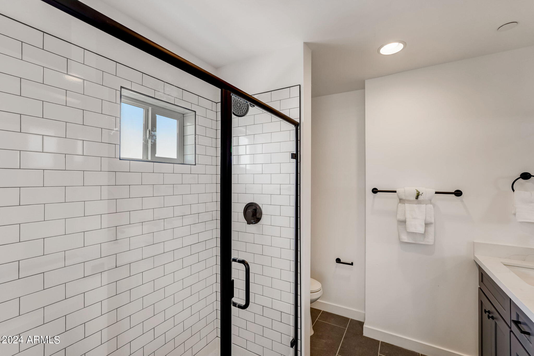 3645 East Earll Drive, Unit 15 Phoenix, AZ 85018 - Photo 19 of 27 a bathroom with a shower