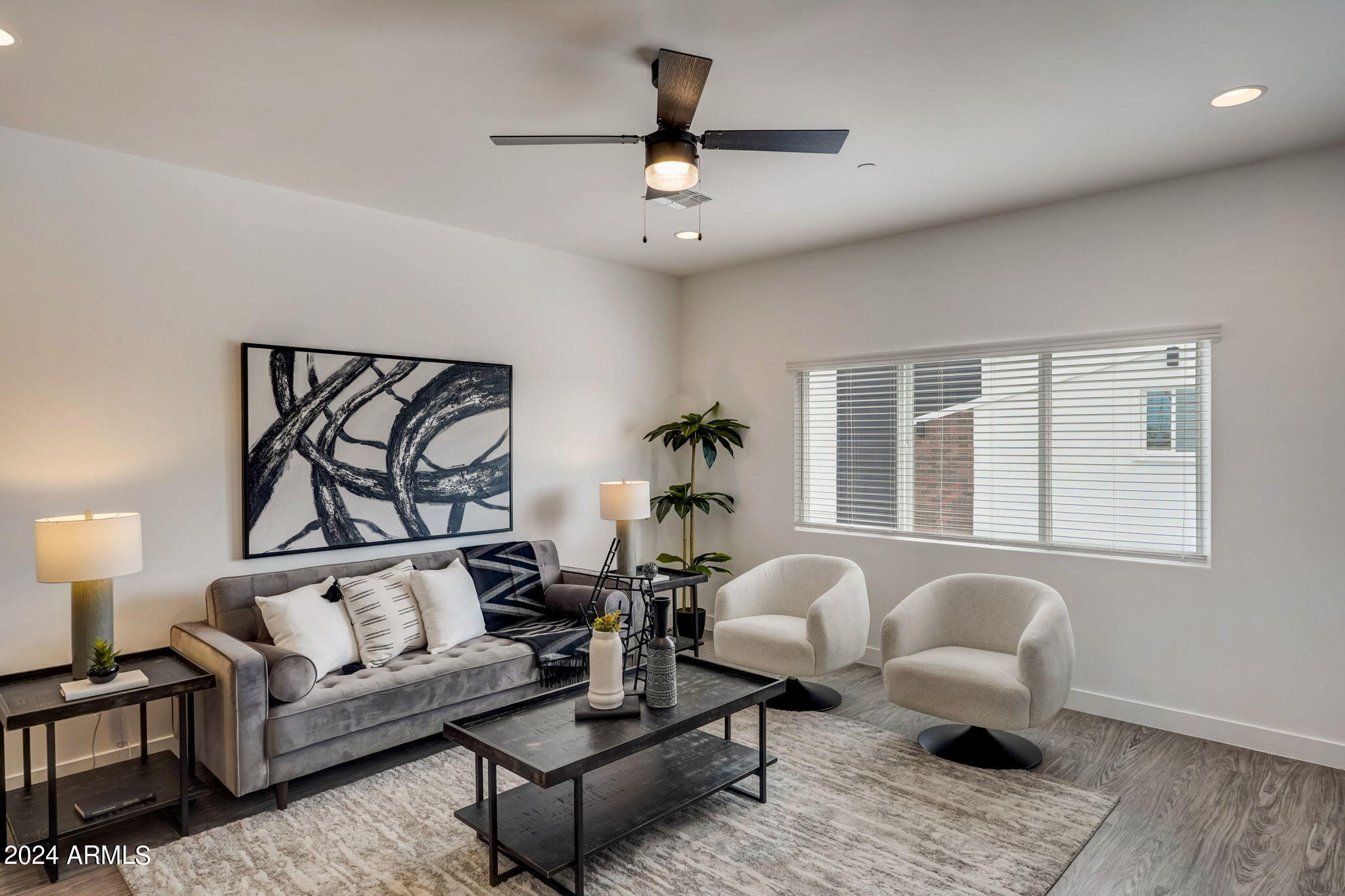 3645 East Earll Drive, Unit 15 Phoenix, AZ 85018 - Photo 2 of 27 a living room with furniture or window and a table