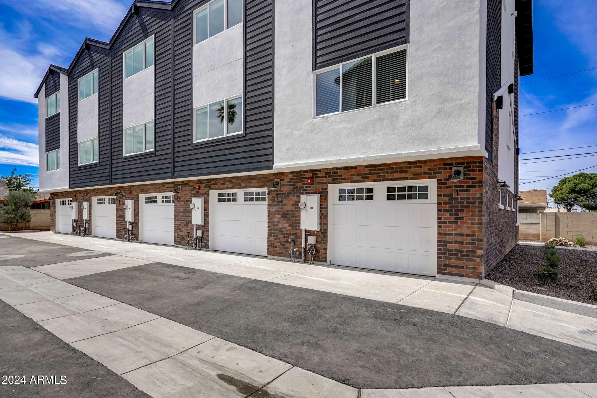 3645 East Earll Drive, Unit 15 Phoenix, AZ 85018 - Photo 25 of 27 a front view of a house with a garage