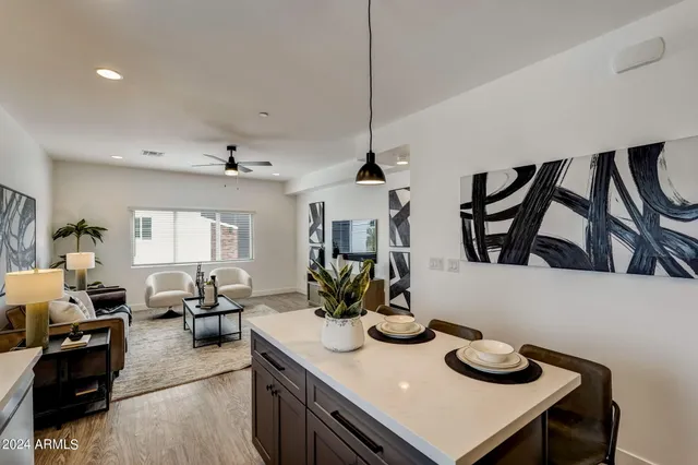 a kitchen with sink and cabinets