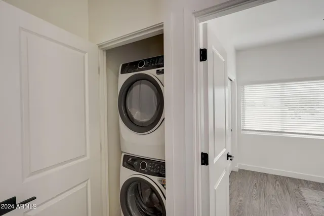a view of a hallway with washer and dryer