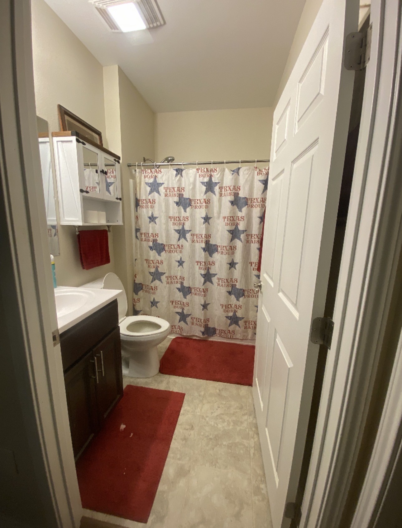 500 Warnock Glade Road Colmesneil, TX 75938 - Photo 12 of 18 a bathroom with a sink a toilet a shower and a mirror