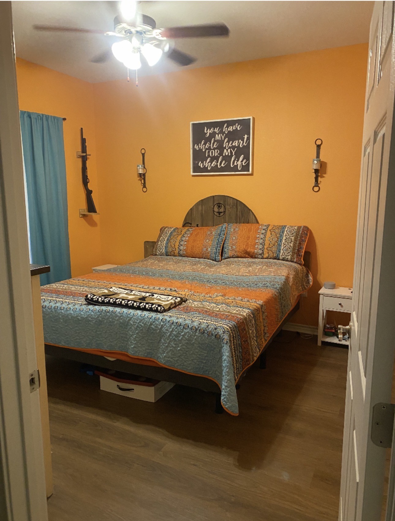 500 Warnock Glade Road Colmesneil, TX 75938 - Photo 6 of 18 a bedroom with a bed and a chandelier