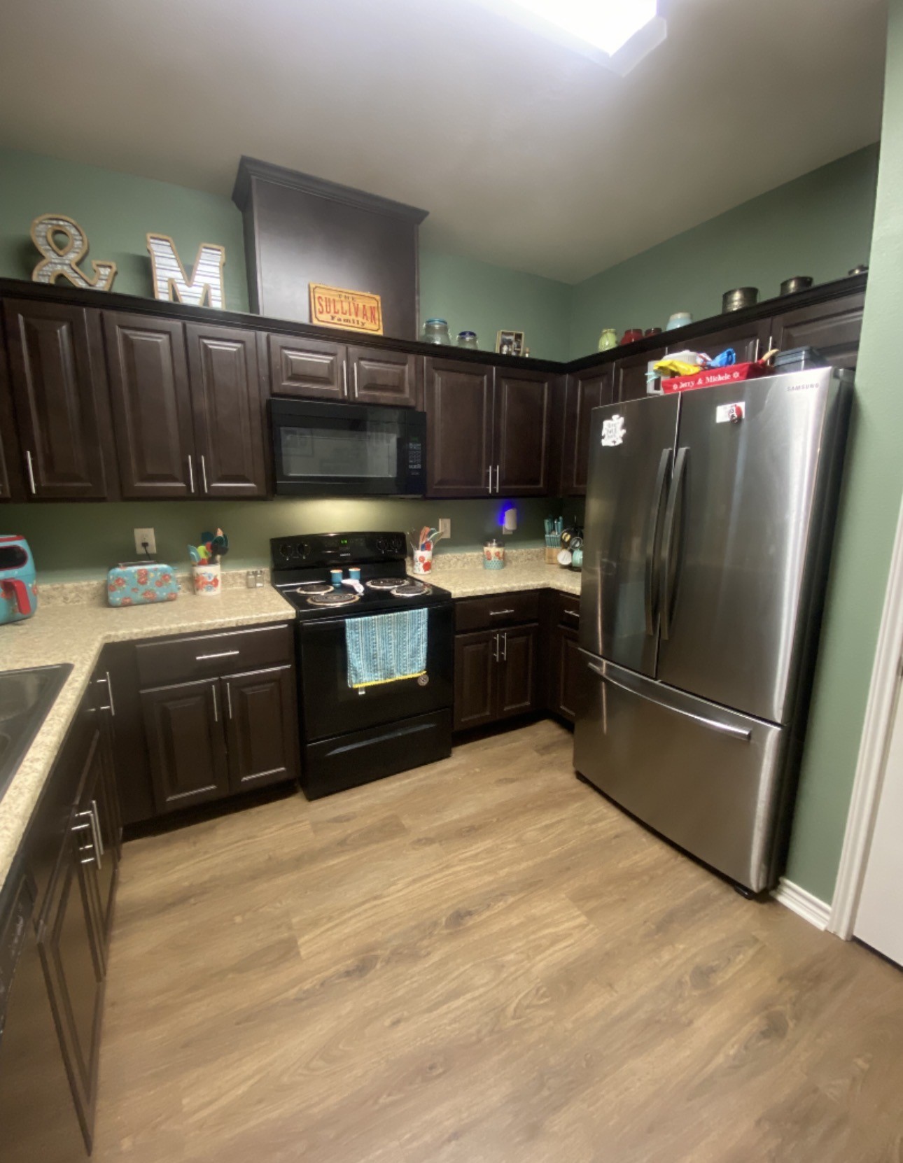500 Warnock Glade Road Colmesneil, TX 75938 - Photo 8 of 18 a kitchen with stainless steel appliances granite countertop a sink stove and refrigerator