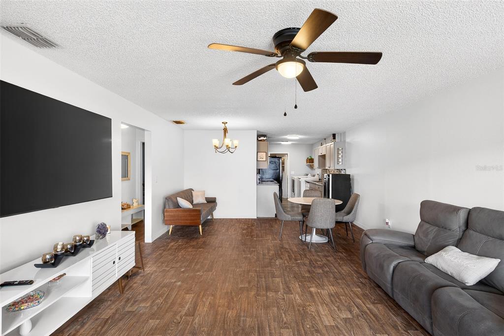 622 Ridge Terrace Winter Haven, FL 33881 - Photo 4 of 29 a living room with furniture and a flat screen tv