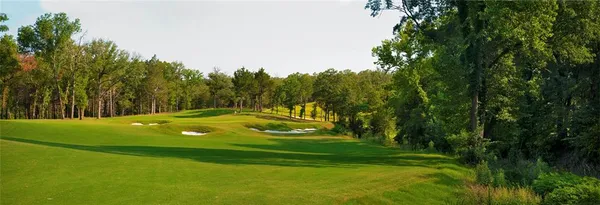 a view of a golf course with a swimming pool